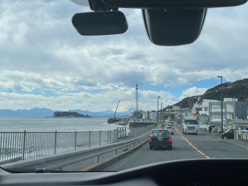 Photo from a car with Mt. Fuji behind a cloud