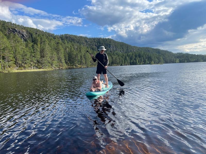 Helmut and I paddleboarding on a lake