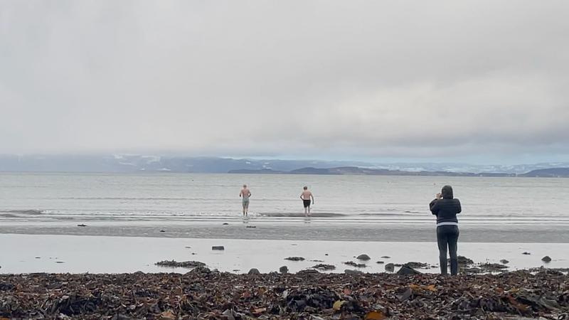 Helmut and I running into the ocean in Norway